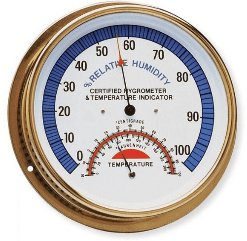 Higrômetro analógico tradicional com escala de umidade relativa e temperatura.